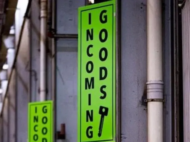 Projecting Incoming Goods shopfront sign