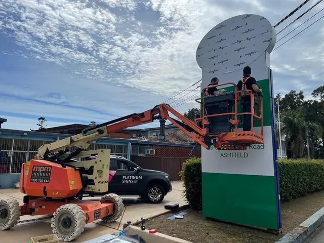 Pylon sign installation with access equipment