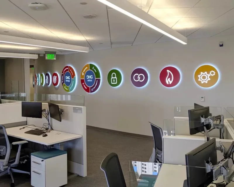 Coloured circular brand graphics in an office
