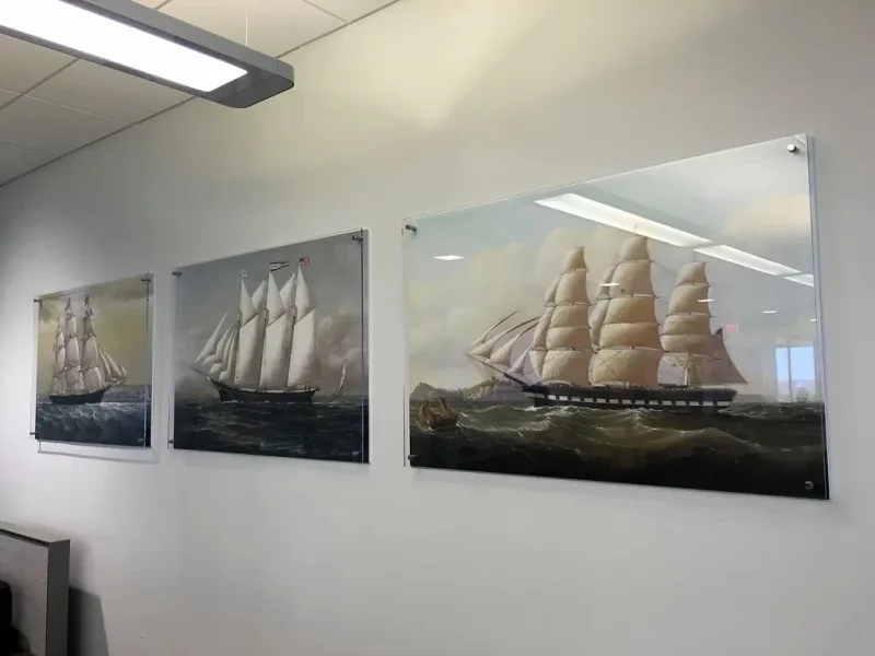 Three sailing-ship prints mounted on clear wall panels